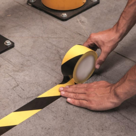 Yellow and black adhesive roll. 33 meters x 100 millimeters.