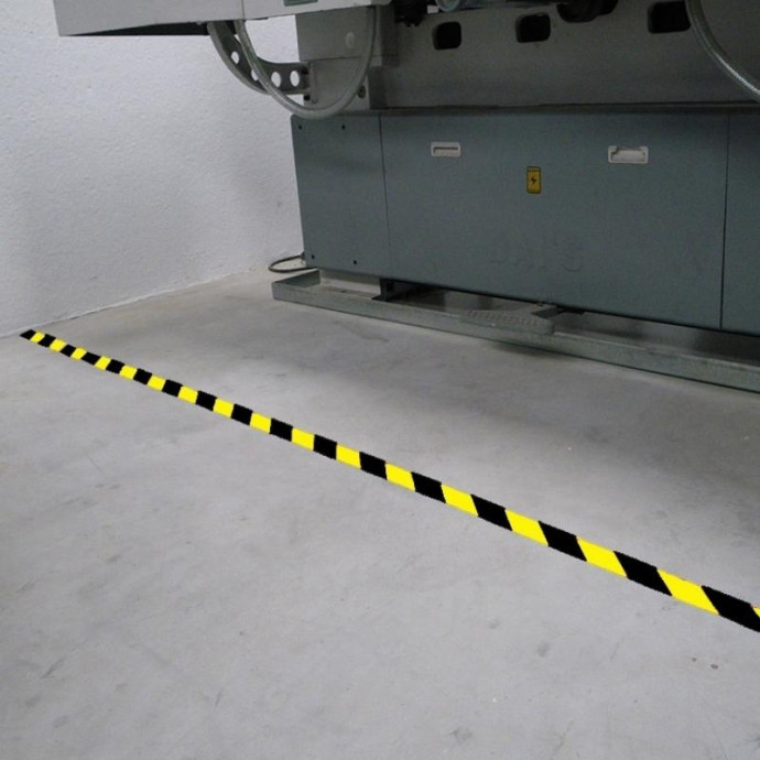 Yellow and black adhesive roll. 33 meters x 100 millimeters.