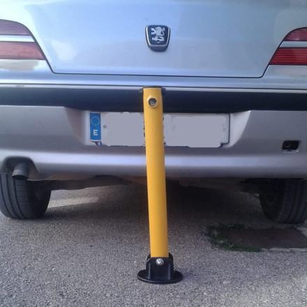 Folding parking barrier with lock. Yellow color.